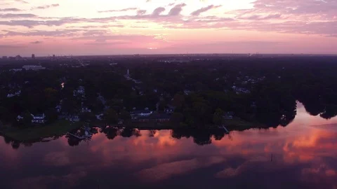 Sun Peaking through the clouds after sunrise Stock Footage 119915741
