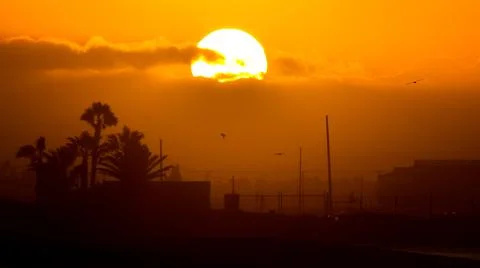 Sun Peaking Through The Clouds Stock Photos