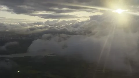 Sun is peaking through the clouds, unique skyscape Stock Footage 243771400