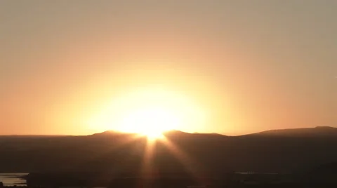 Sun Peaks Over Hillside On Clear Morning Video stock 68005198