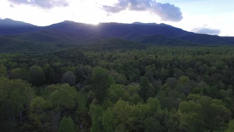 Sun Peeking Over the Mountains Stockbeeldmateriaal 128544225