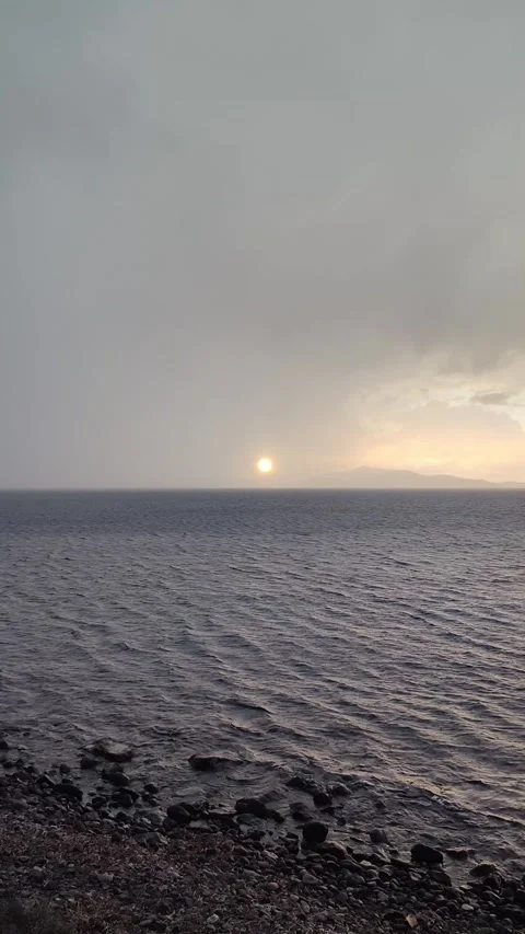 The sun peeking through the clouds after a rainy day Stock Footage 325039986