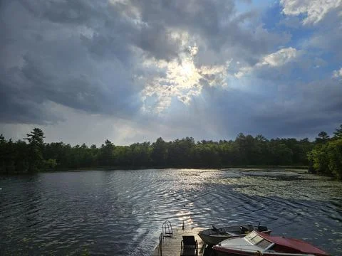 Sun peeking through the clouds after storm Foto stock
