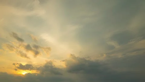 The sun peeks out from dark clouds for a brief moment Stock Footage 339404995