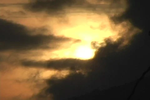 Sun peeks through clouds Stock Footage 286867