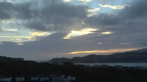 Sun peeks through clouds 库存影片 4906755