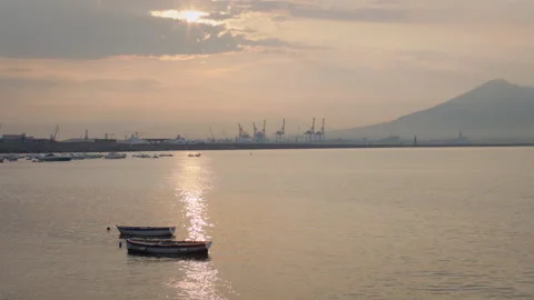 Sun peeks through clouds over Naples port Stock Footage 136395973