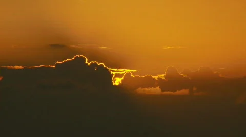 Sun pokes through clouds as it sets. Stock Footage 375816