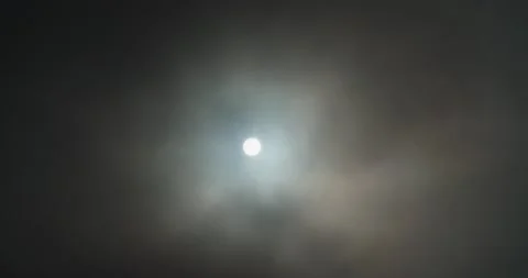 Sun poking through clouds Stock Footage 133204025