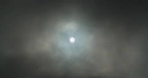 Sun poking through clouds Stock Footage 133204181