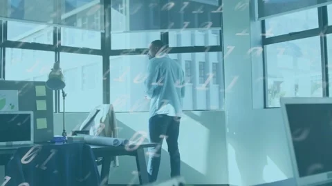 Sun pouring through windows urging designer shifting and reviewing plans, data Stock Footage 333720064