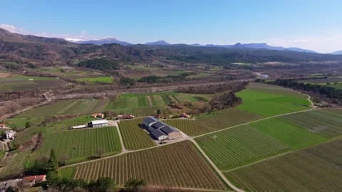 Sun-powered panels placed on barn roof in French field Stock Footage 307313118