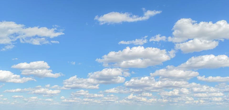Sun on the puffy clouds. Background with clouds on blue sky. Clouds on sky. 写真素材