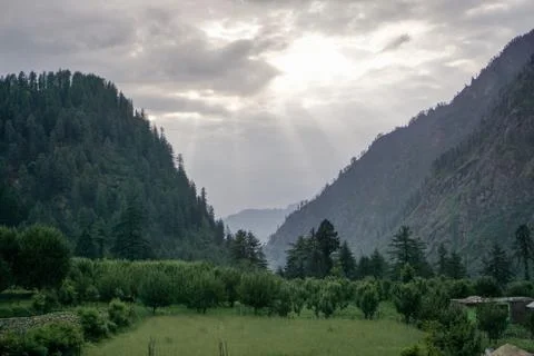 Sun Raise Coming Out from Clouds in Mountain Area Stock Photos