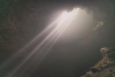 Sun ray falling into Jomblang Cave, Central Java, Indonesia Stock Photos