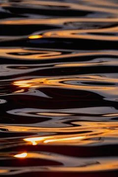  sun ray relection on water surface sun ray relection on water surface Cop... Stock Photos