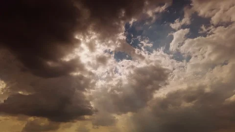 Sun ray shining emerging through the dark clouds . Stock Footage 103830069