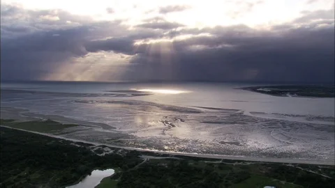 Sun ray shining through clouds in the sea Stock Footage 99058487