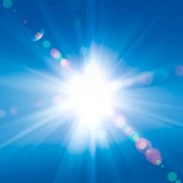 Sun rays against a blue sky Stock Photos