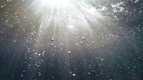 Sun rays and bubbles under the water Stock Footage 84504575