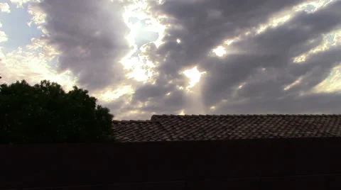 Sun Rays and Clouds over the roof, Windy Day Stock Footage 53232537