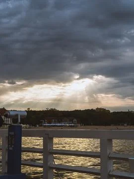 Sun rays and clouds on the sea Stock Photos