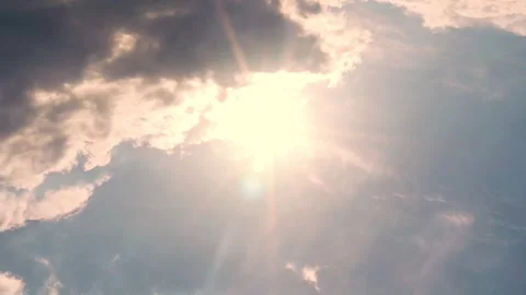 Sun With Rays and Glare, Light Pink Blue Sky and Puffy Clouds, Slow Motion, Time Stock Footage 241826113