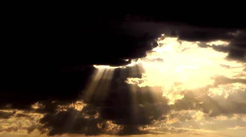 Sun rays are hitting from behind the clouds brightly God salvation and mercy Stock Footage