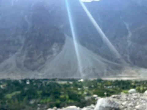 Sun Rays Beaming Through Clouds Over Nomal Valley Gilgit Stock Photos