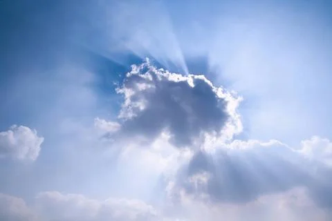 Sun rays behind the cloud sun rays behind the cloud,beautiful blue sky Cop... Stock Photos