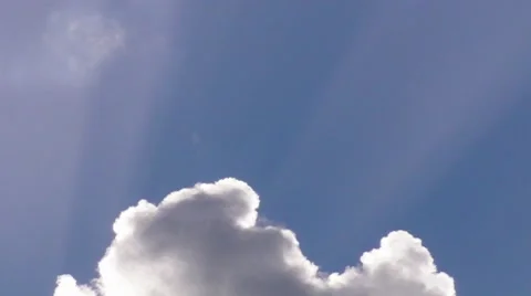 Sun Rays Behind Clouds and Blue Sky 2 Stock Footage 7756062