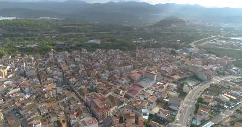 Sun rays between clouds seen from the heights of Spanish town Stock Footage 214664691