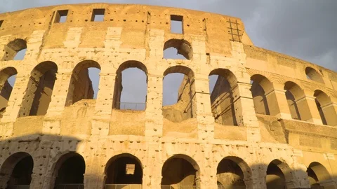 Sun rays on the big wall of the Colosseu... | Stock Video | Pond5