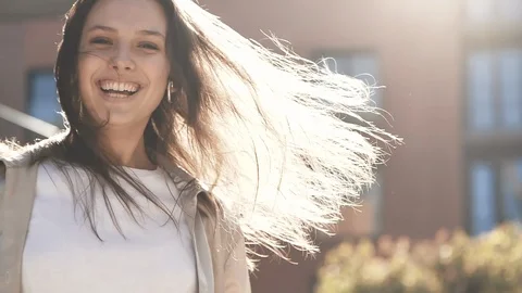 Sun rays Bleaching to the camera Happy girl running on street. Video stock 123236822