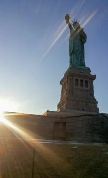 Sun rays blessing the Liberty Statue in USA Stock Photos