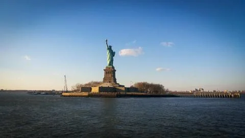 Sun rays blessing the Liberty statue in USA Stock Photos