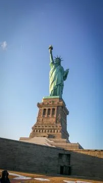 Sun rays blessing the Liberty statue in USA Stock Photos