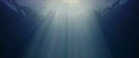 Sun rays in blue water, waves on the water surface, abstract Stock Footage 143535001