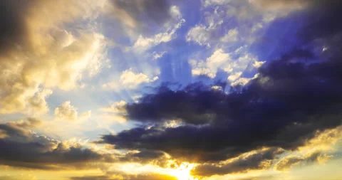 Sun rays break through dark storm clouds Stock Footage 201259220