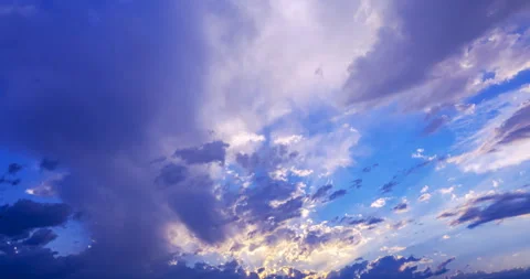 Sun rays break through dark storm clouds Stock Footage 203948086