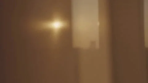 Sun rays break through tulle hanging on window of apartment Video stock 243308755