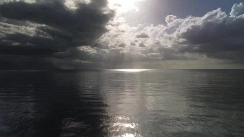 Sun Rays Breaking Through Clouds Over Ocean Drone Shot Stock Footage 337234774