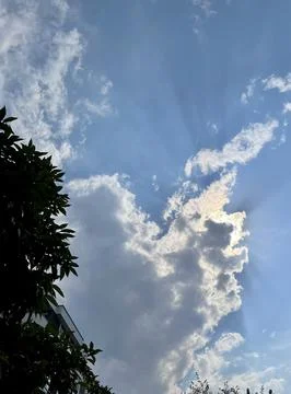 Sun Rays Breaking Through the Clouds Stock Photos