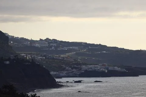 Sun rays breaking through clouds above the coastline of Tenerife Fotos de archivo