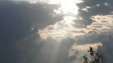 Sun rays breaking through dark clouds Stock Footage 316239609