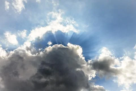 Sun Rays Burst from Behind a Cloud Stock Photos