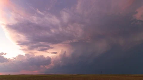 Sun rays cast golden colors on storm Stock Footage 272748403