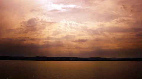 Sun rays, clouds and water time lapse Stock Footage 5998195