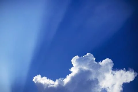 Sun rays with clouds on blue sky landscape.rays of light. Stock Photos