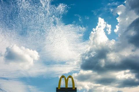 Sun rays in the cloudy sky. Nature background. Stock Photos